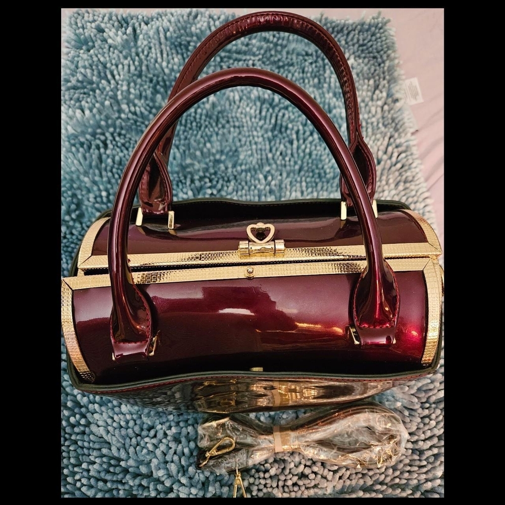 Elegant Burgundy Handbag with Gold Accents